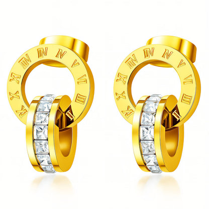 Gold hoop earrings with embedded crystals on a white background