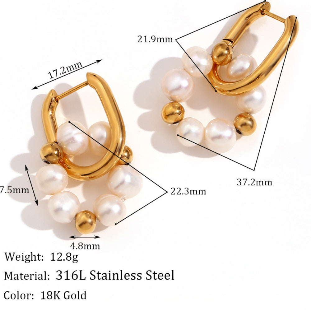Gold and pearl earrings with measurements and material details on a white background