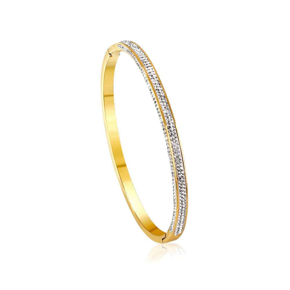 Gold bracelet with embedded diamonds on a white background