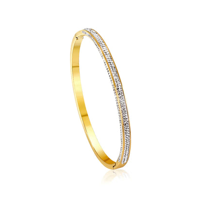 Gold bracelet with embedded diamonds on a white background